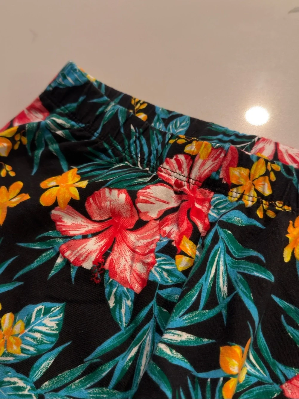 No Boundaries Black Tropical Floral Capri Leggings with Pink & Yellow Flowers